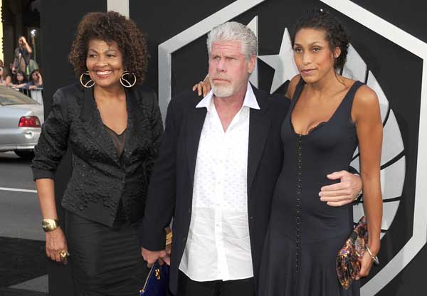 Opal and Ron Perlman taking picture with their daughter.